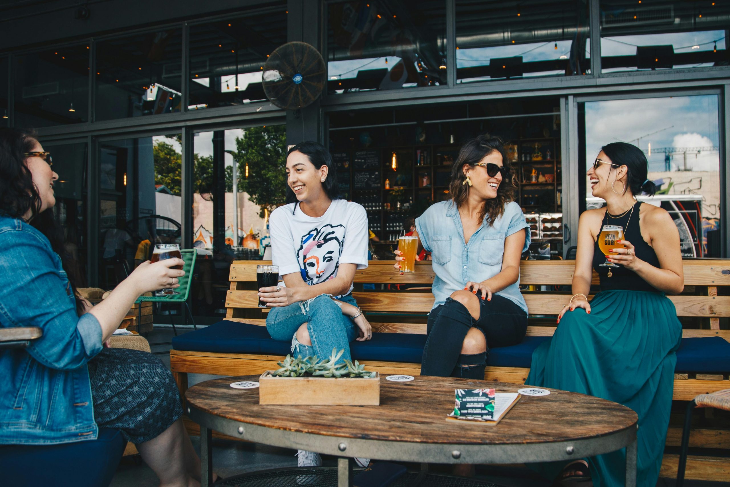 women socializing at a bar